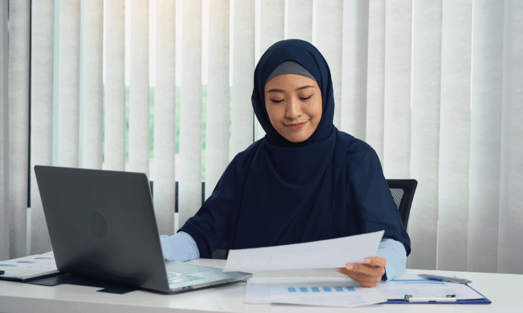 malaysian outsourced bookkeeper working on documents
