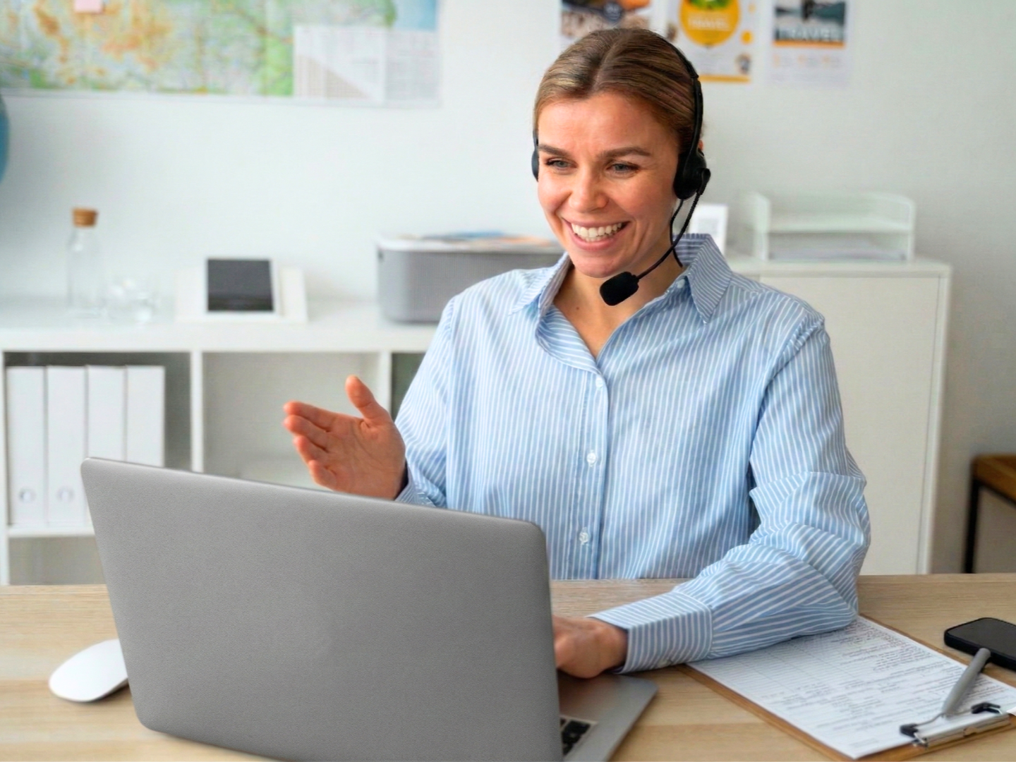 offshore customer service representative in argentina working in an office with a laptop on a desk