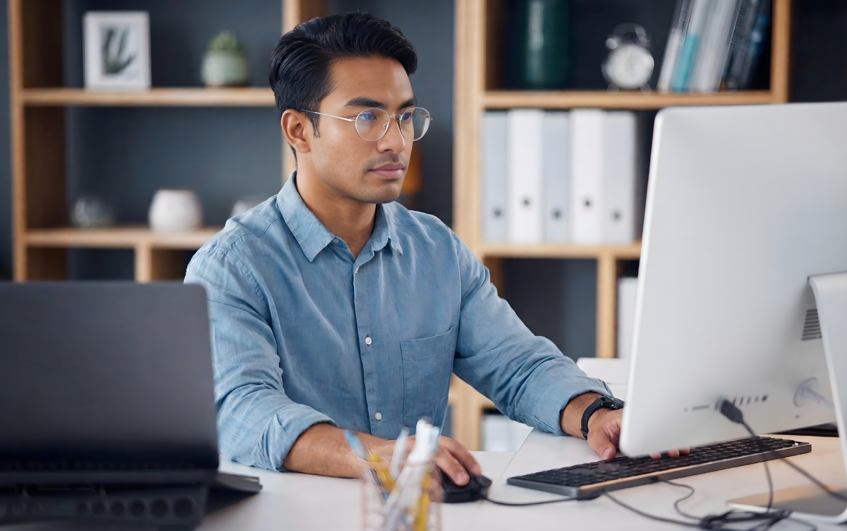 remote salesforce administrator seriously working in a dual monitor setup