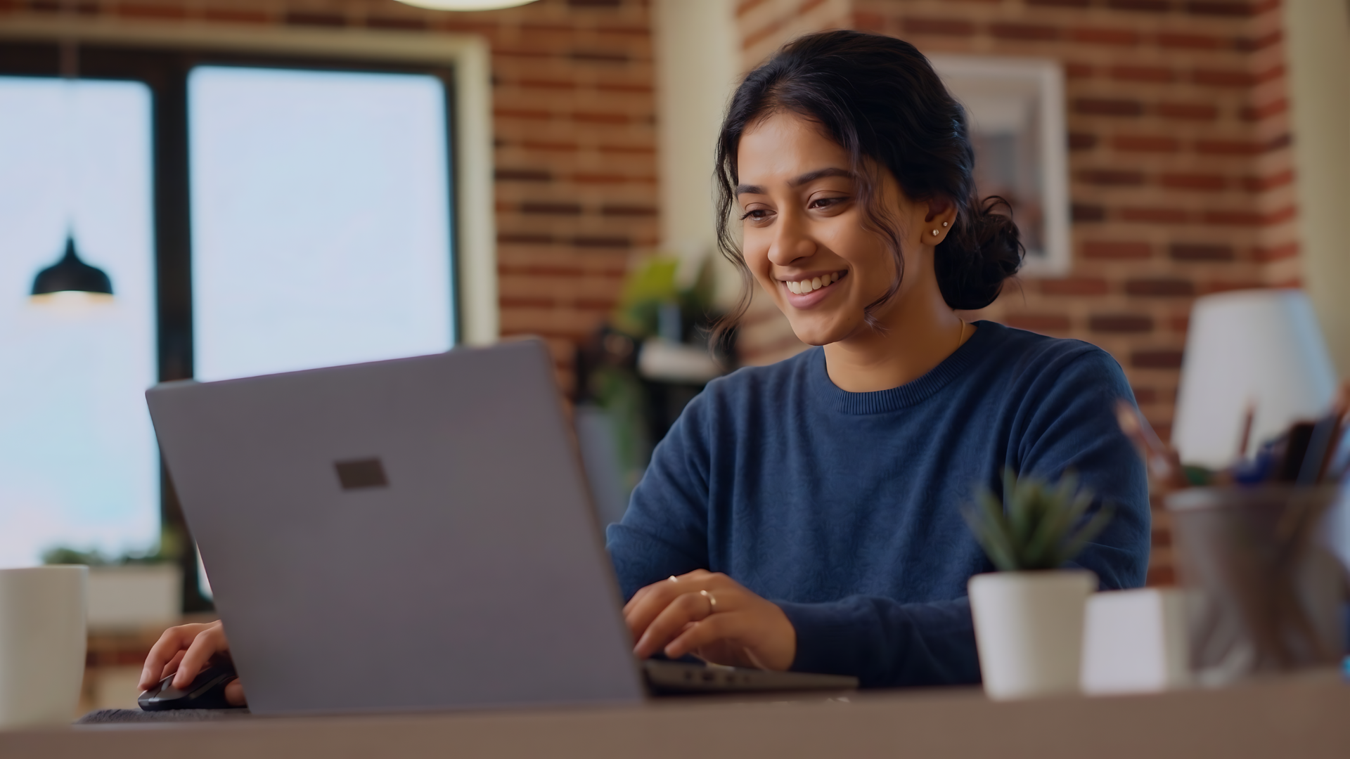 digital content producer in india happy working with a laptop