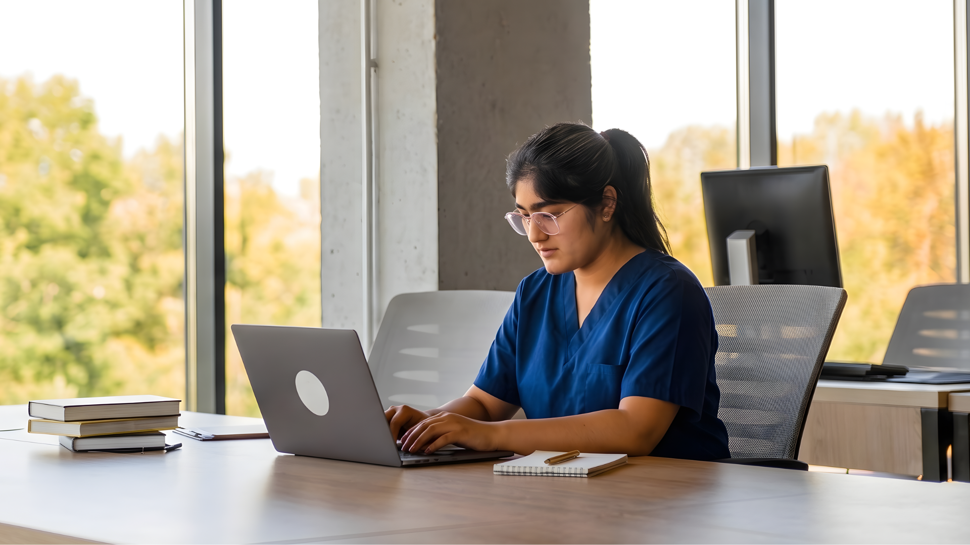 indian remote clinic research associate documenting a research in a open office