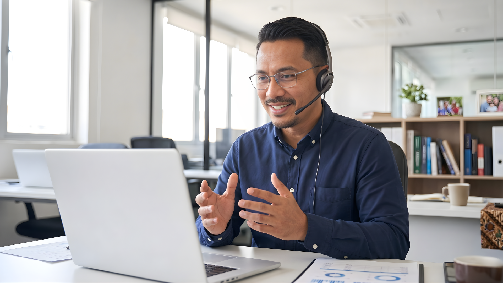 malaysian male a remote sales operations specialist having a virtual meeting