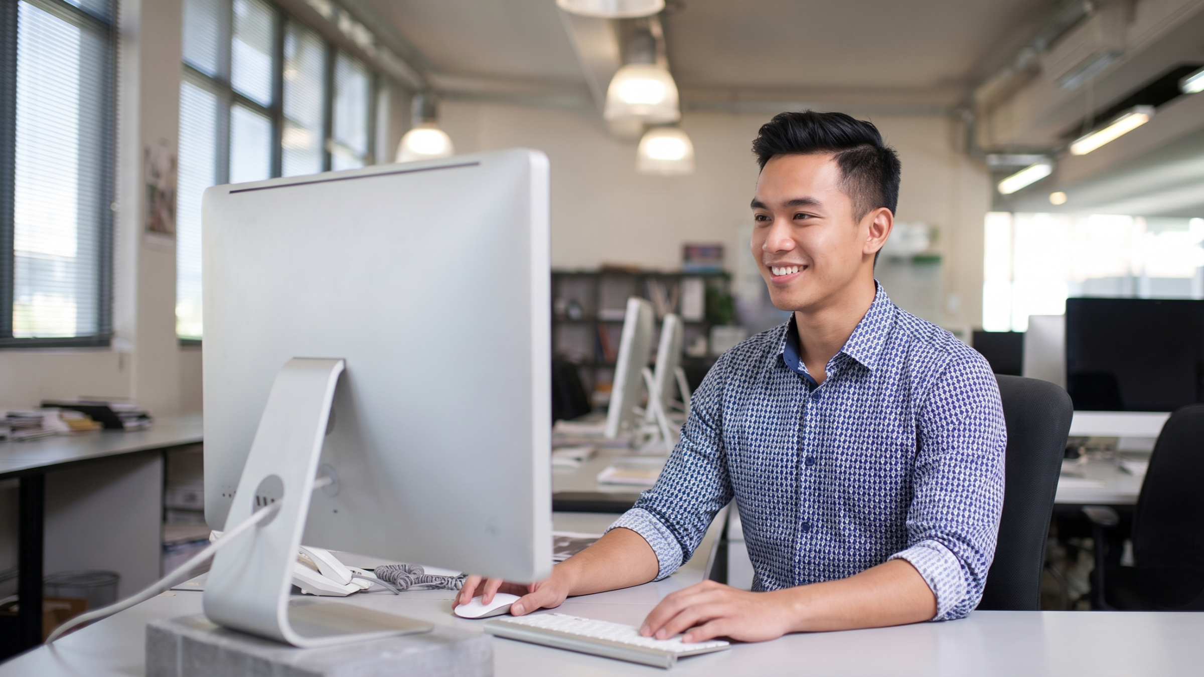 demand planner remote in malaysia analyzing data in a computer