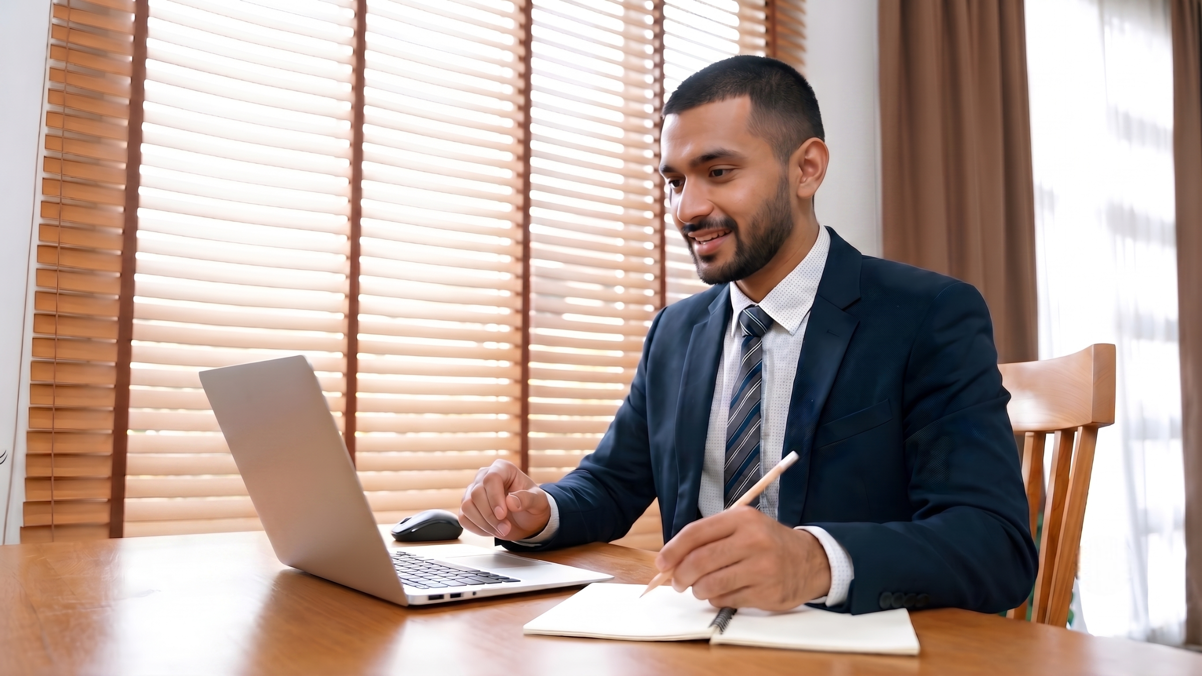 remote legal assistant working with a laptop at a home office