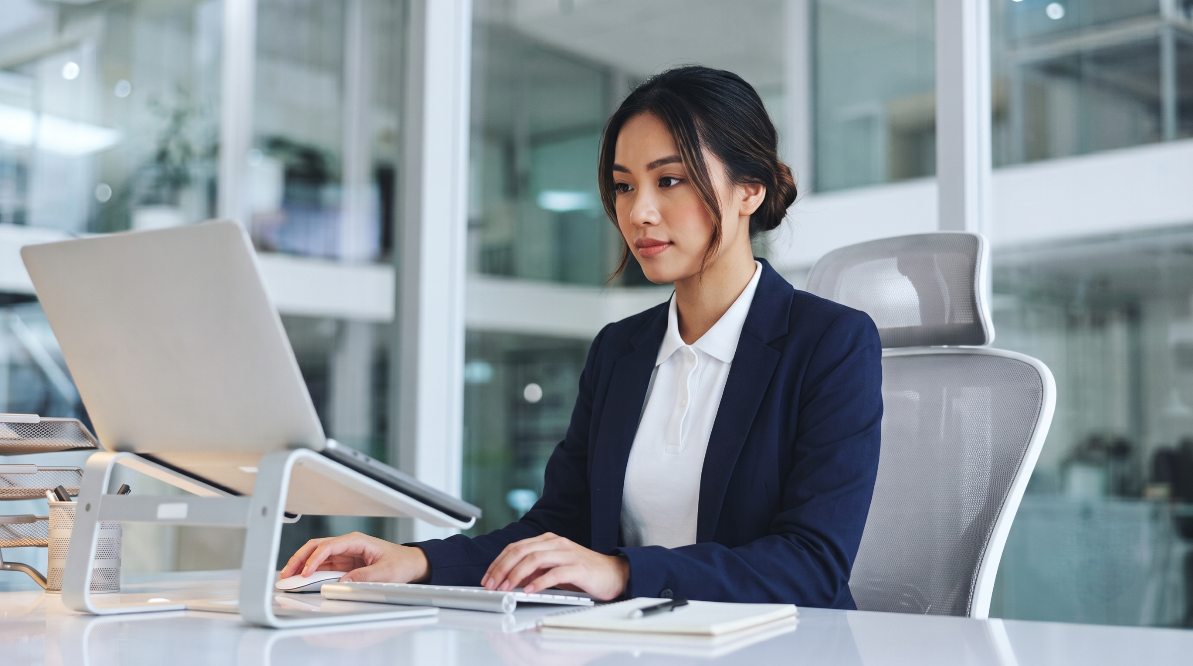 female specialist focusing on revenue operations outsourcing in Vietnam using a laptop