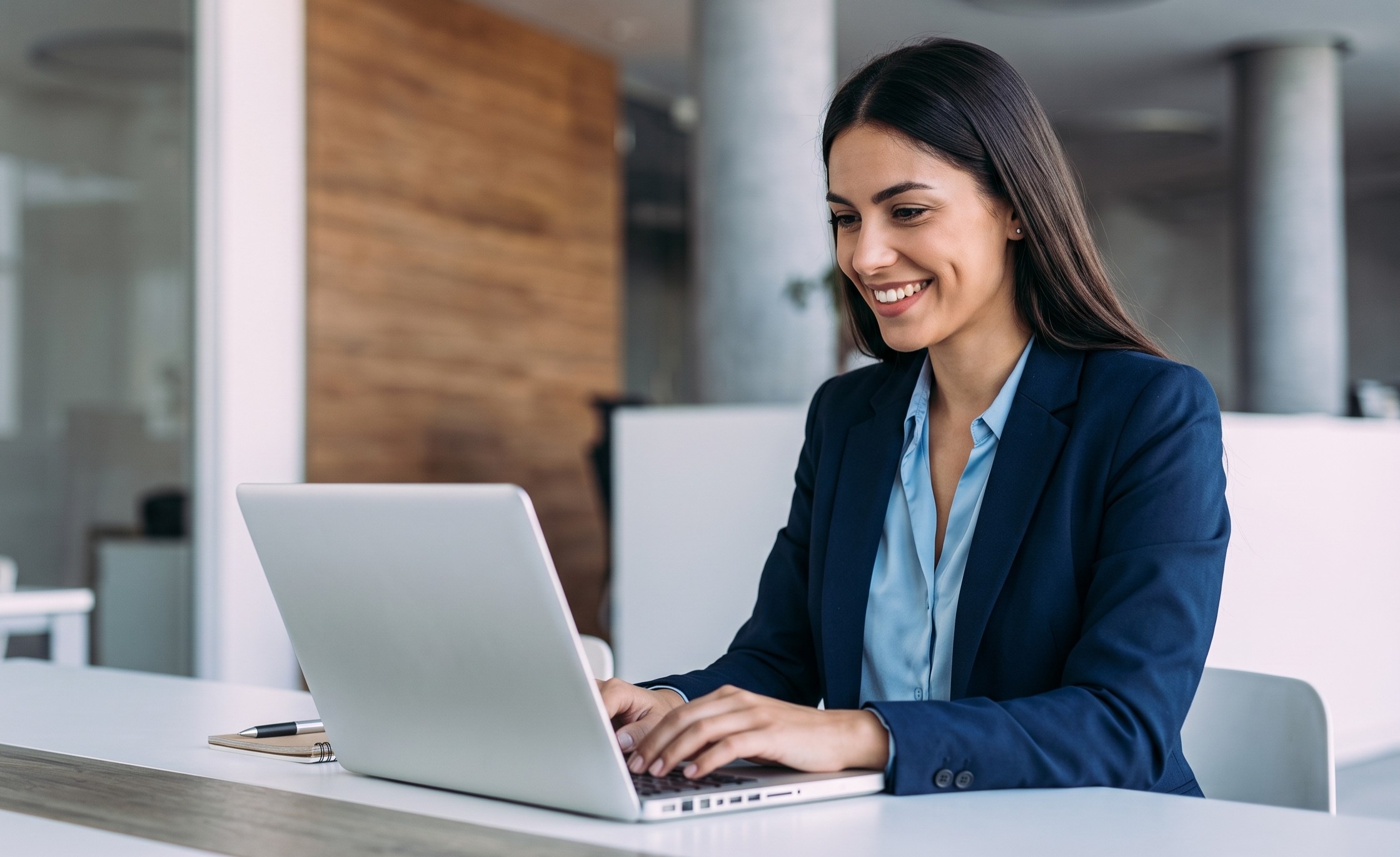 Professional handling outsourced management accounting tasks remotely on a laptop