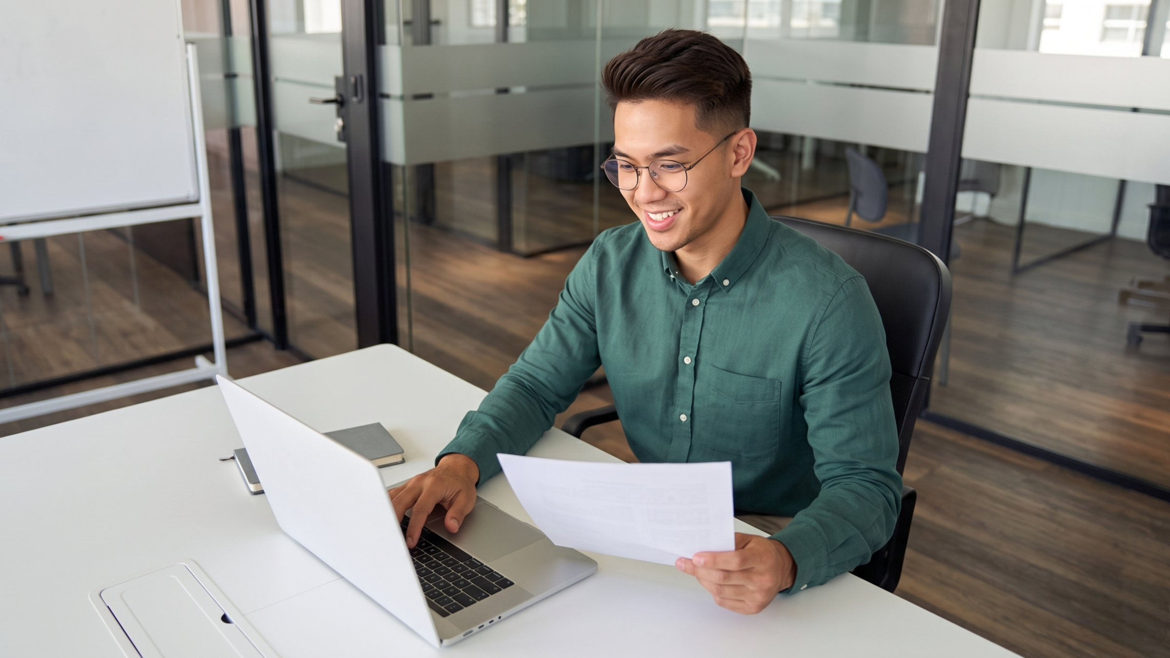 Professional smiling while reviewing documents for open scrum master positions