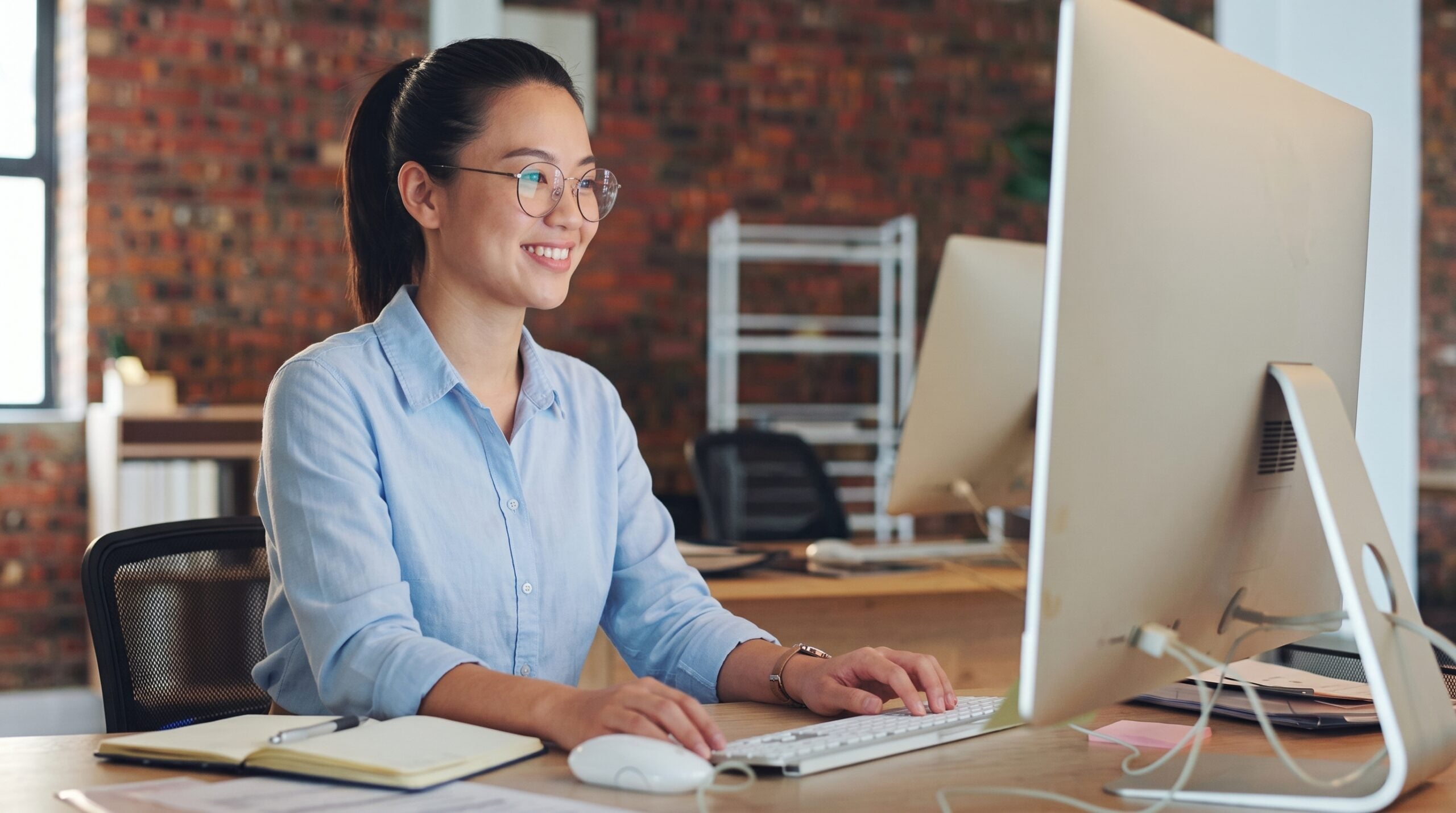 vietnamese virtual assistant accountant working with computer at the office