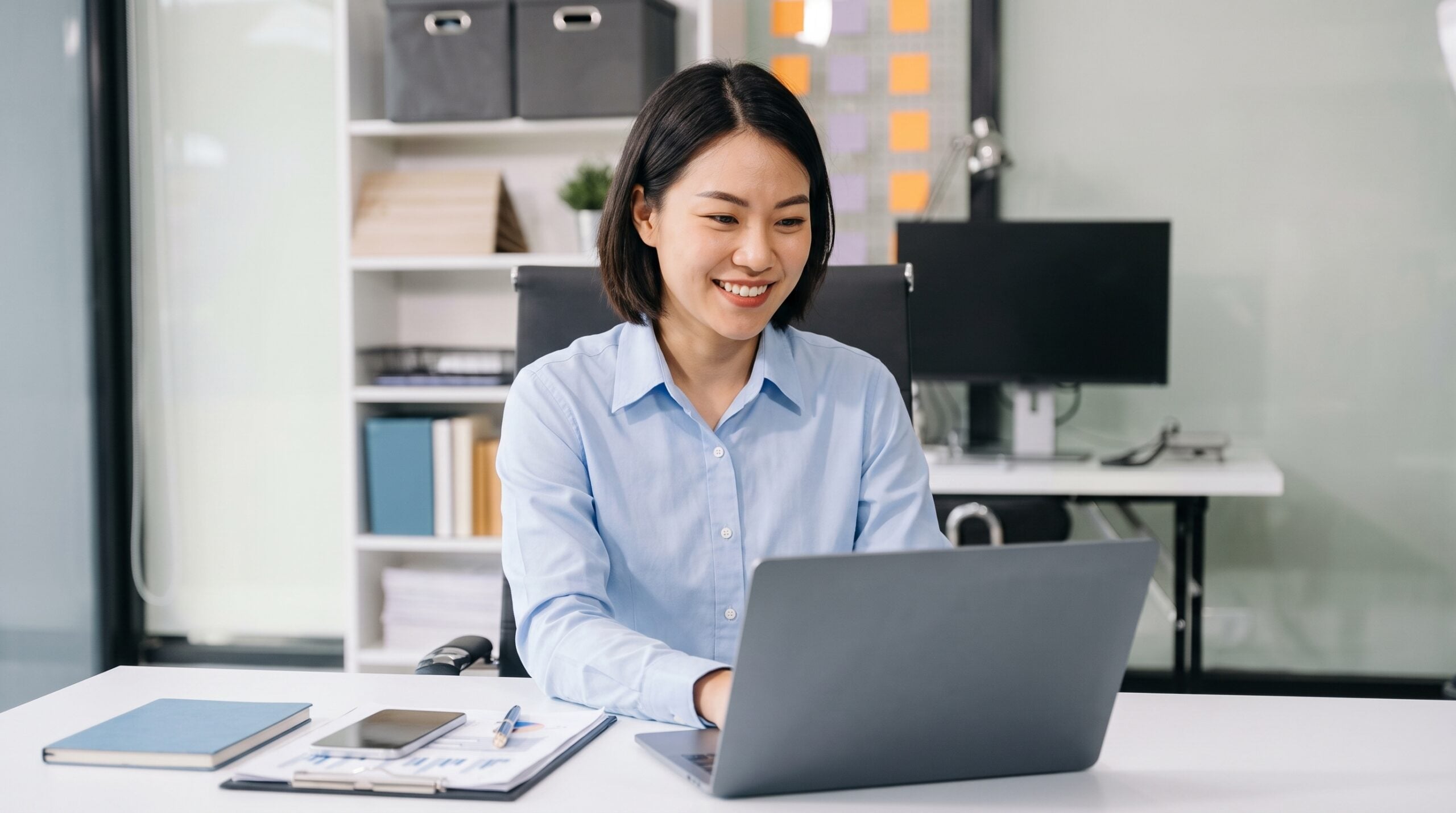 professional and dedicated remote investment operations specialist working on a laptop